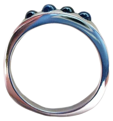 An 18kt White Gold Ring
set with  Blue Sapphire Cabochons