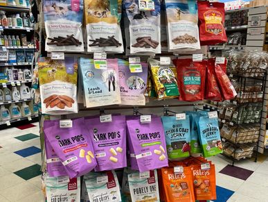 natural treats for dogs and cats on a store rack