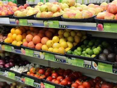 fresh organic citrus fruits, tomatoes, and apples