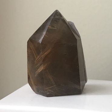 small smoky quartz with rutile inclusions. 35mm tall 24mm wide approx £13