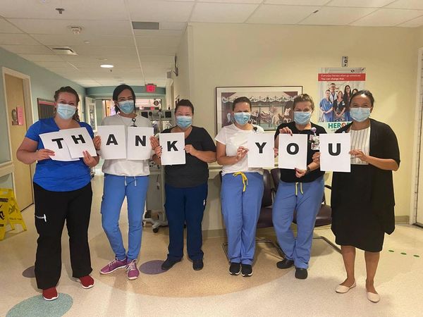 Nurses in PAEDS hold up Thank You Sign