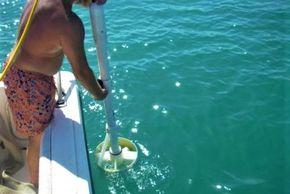 Measuring turbidity in the water. Photo courtesy of CEE Staff.