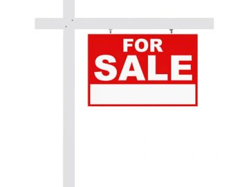 A red and white 'For Sale' sign on a post.