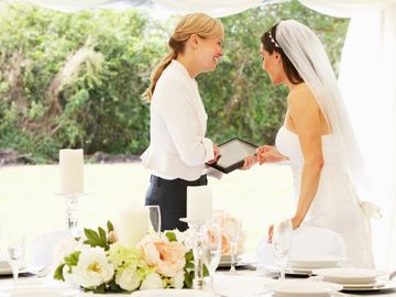 wedding coordinator helping a bride on her wedding day