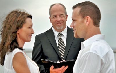 Tom Hamel of My West Michigan Wedding performing a marriage ceremony