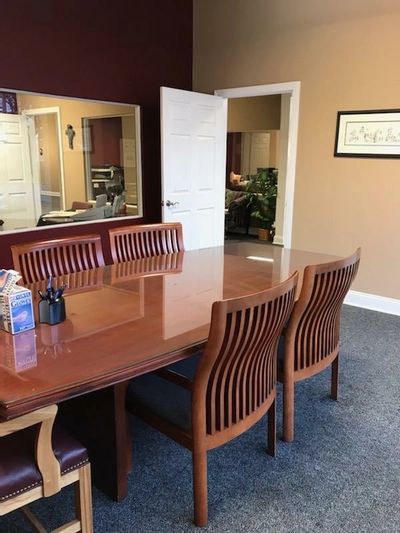 LCT street level conference room showing large glass window to separate closing agent & customer.