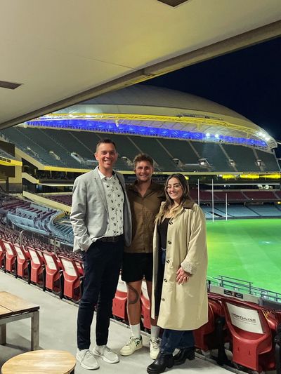 Wedding couple at Adelaide Oval, meeting with Reed for wedding celebrant discussion