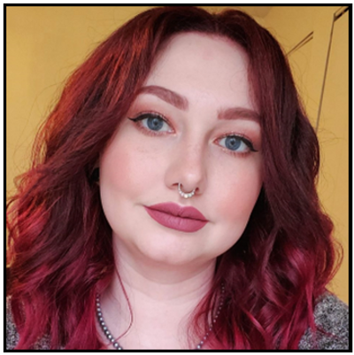 a close up of a person with red hair