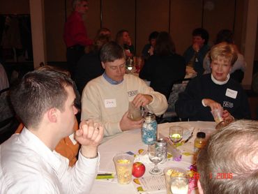 a group of people sitting around a table
