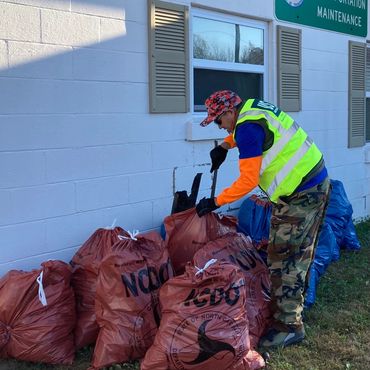 A man delivers trash bags to NCDOT.