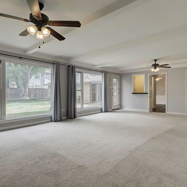 This large traditional features a huge living room with views of the golf-course adjacent back yard.