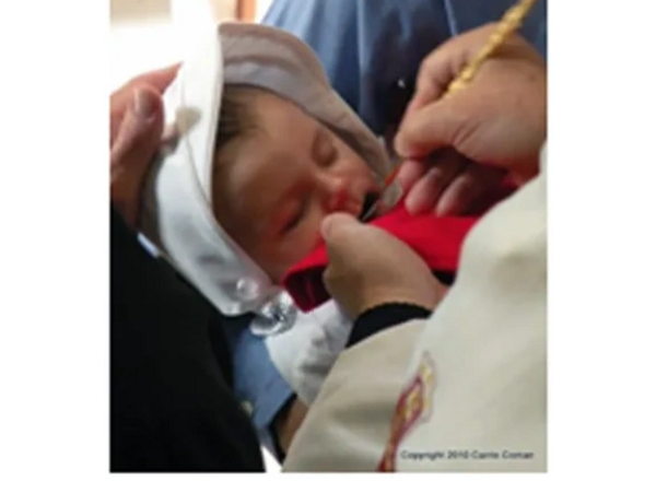 child receiving holy communion
in the Orthodox Church