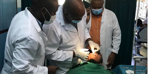 Tanzania Oral Surgery Group performing a procedure on patient in Tanzania Africa