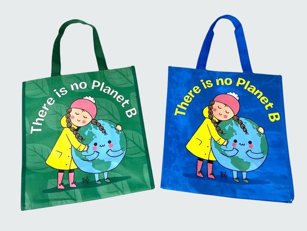 the fronts of two cute, reusable tote bags placed side by side. One green, one blue
