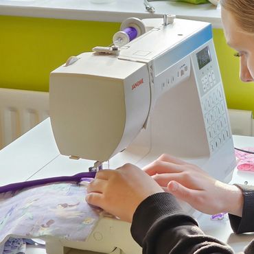 Teenager at a sewing machine