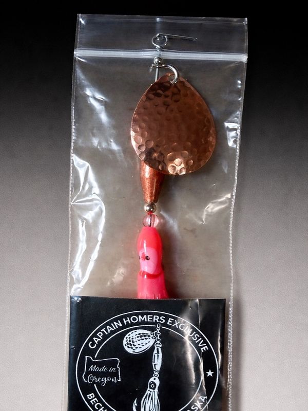 Pink custom lure in Captain Homers packaging labeled Becharof Lodge – Alaska.