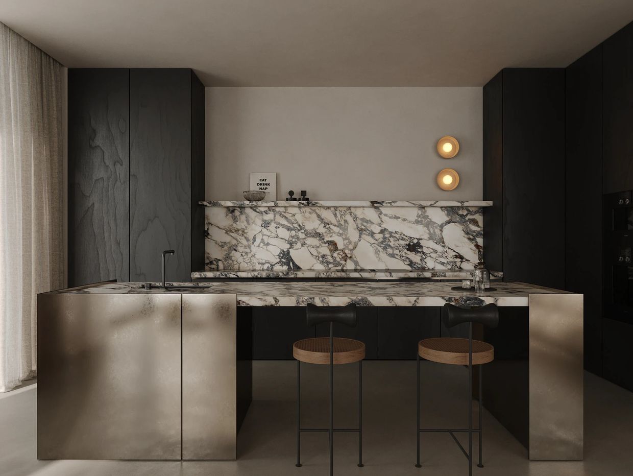 Modern kitchen with marble countertops and dark cabinetry.