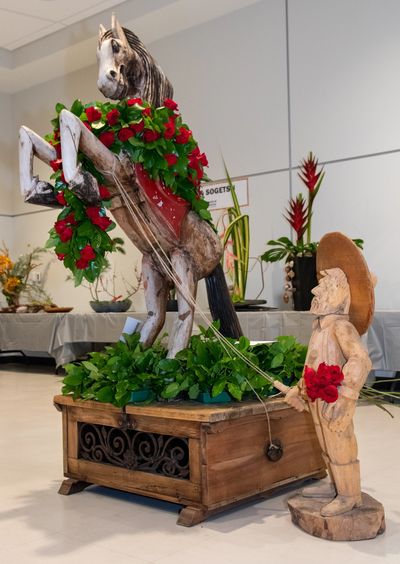 a horse statue decorated with flowers