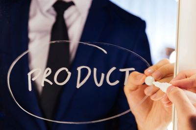 Product Management - Business person writes "Product"