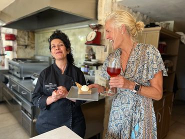 two women talking while having a drink