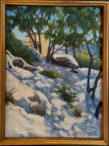 "Sunset Studio" a 6" x 8" painting of a small yellow building seen through trees of a snowy landscap