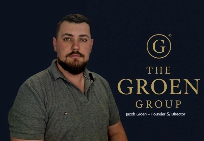 Man in grey shirt with The Groen Group logo and founder's name against dark background.