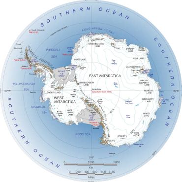 Detailed map of Antarctica with geographic features and research stations.