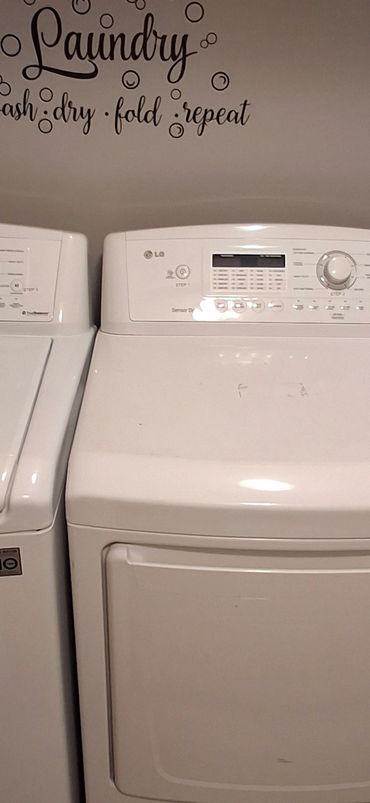 Laundry room with large-capacity washer and dryer. Scheduled resident use. No coin operation.