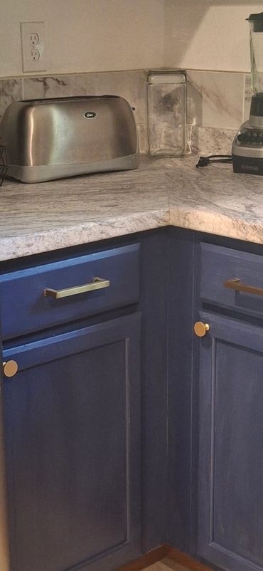 Countertop area with small appliances, including toaster, and blender.