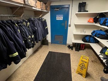 Men’s locker room, rug, floor, door