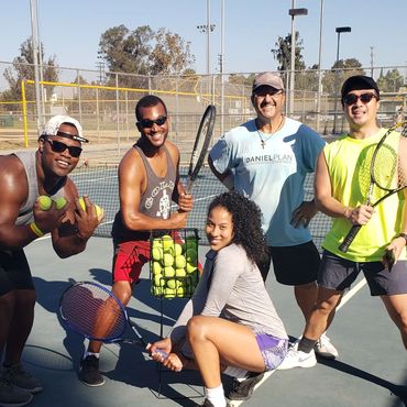 Tennis Clinic students after Jungle Ball game with Coach David in NoHo tennis with rackets and balls
