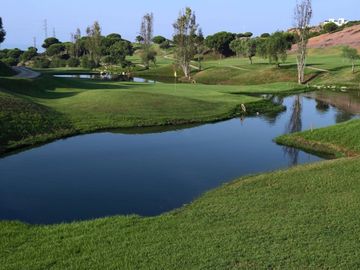 golf course in costa del sol with many water features.