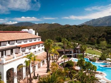 Golf resort hotel in the costa del sol with hotel and pool.