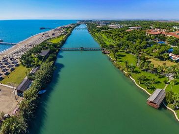 Golf holiday to Costa Del Sol Spain. Golf resort next to the sea with a river alongside.