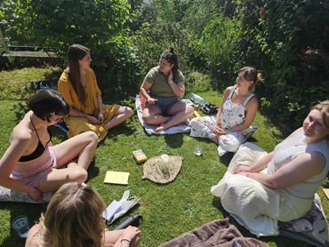 Women sit in a circle outside, hosted by an Antenatal Educator in North Somerset