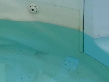 Swimming pool liner in need of a patch.