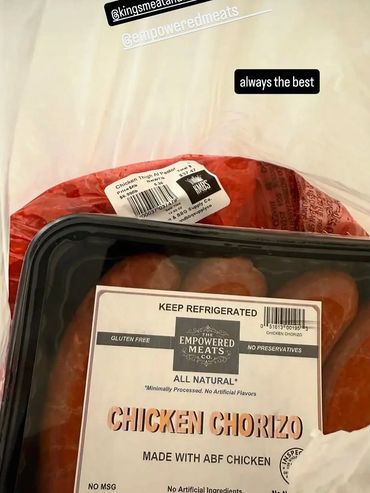Packaged chicken chorizo and chicken thighs labeled from Empowered Meats and Kings Meat & BBQ Supply Co.