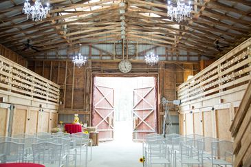 Chairs setup for a wedding on the inside of our barn wedding venue.