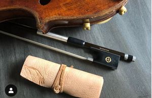 violin with a bow and rosin

