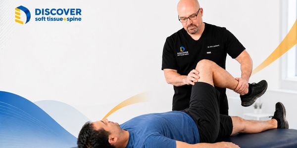 Dr. Lambert evaluating hip movement for hip pain in Grand Rapids