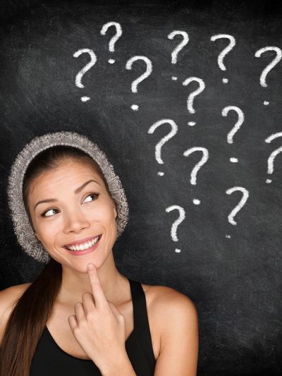 Young woman looking up for the Frequently Asked Questions page