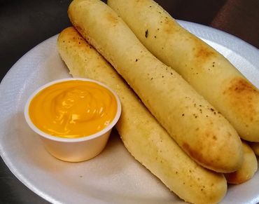 Breadsticks with Cheese Sauce