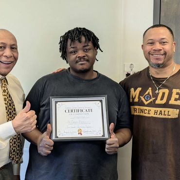 three men standing next to each other holding a certificate
