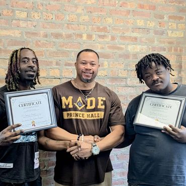 three men standing next to each other holding a certificate