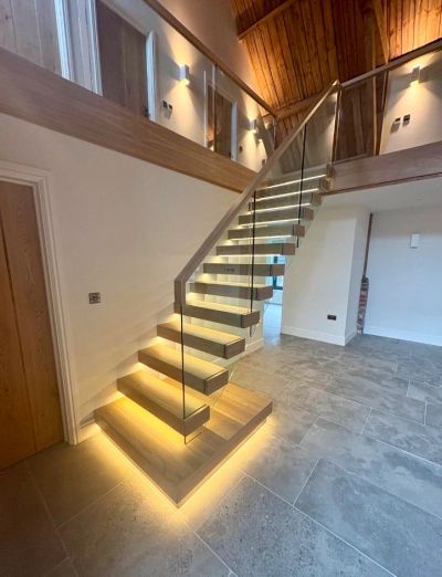Cantilevered staircase with Oak treads and glass balustrading. Floating staircases look great