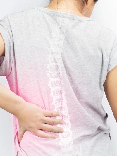 back side of a woman with facing backpain 