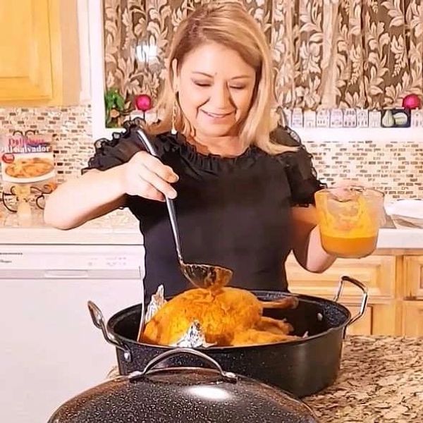 Alicia Maher cooking Salvadoran Christmas turkey