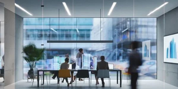 People working in a modern office with digital holographic displays.