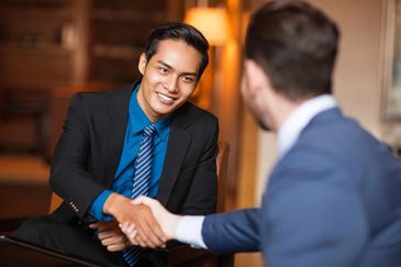 Two people meeting at a business meeting with each other