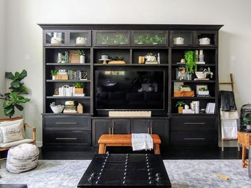 Custom built by Macik Custom Woodworking, this impressive entertainment center has it all!
